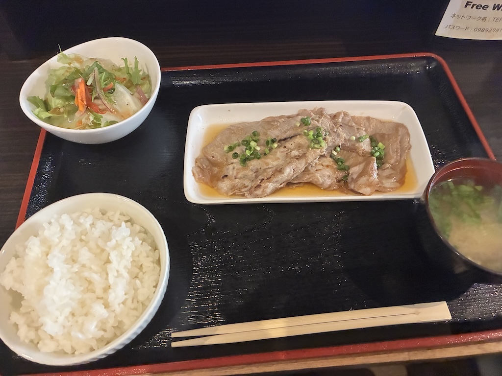 Japanese pork ginger stir-fry shogayaki set meal with rice, miso soup, and fresh salad at Airport Shokudo Naha Airport