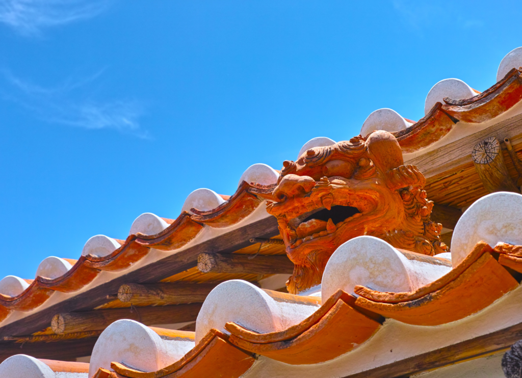 Okinawa traditional shisa roof tile with blue sky