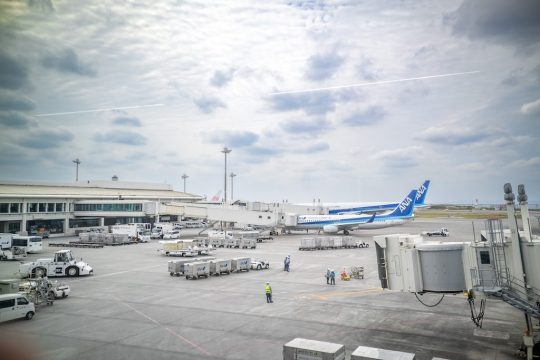 New Chitose Airport apron with passenger aircraft preparing for departure
