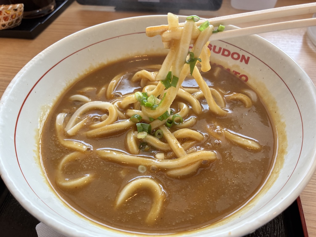 A steaming bowl of Okinawa-style curry udon at a local noodle shop