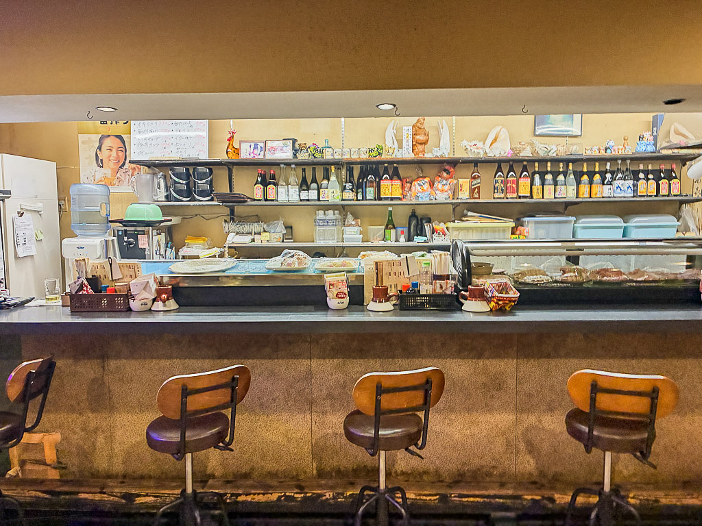 Cozy counter seating inside Yakitori Yasuki in Naha