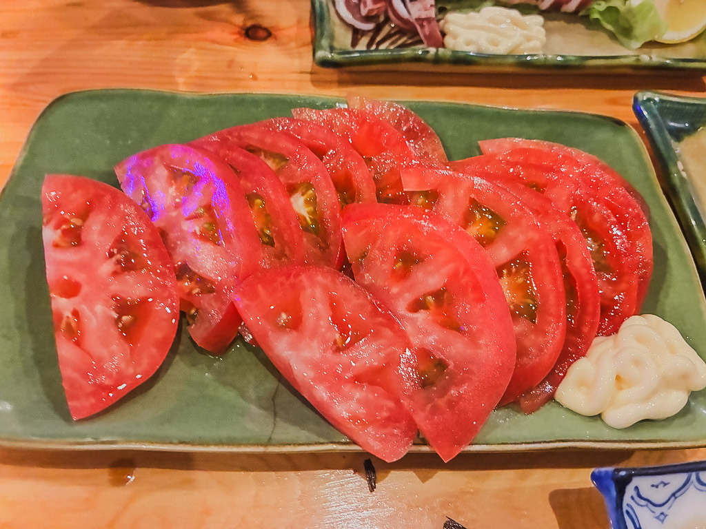 Sliced fresh tomato with mayonnaise at Yakitori Yasuki in Naha