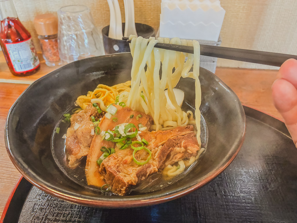 Agarie Soba Honten handmade fresh noodles being lifted from the bowl
