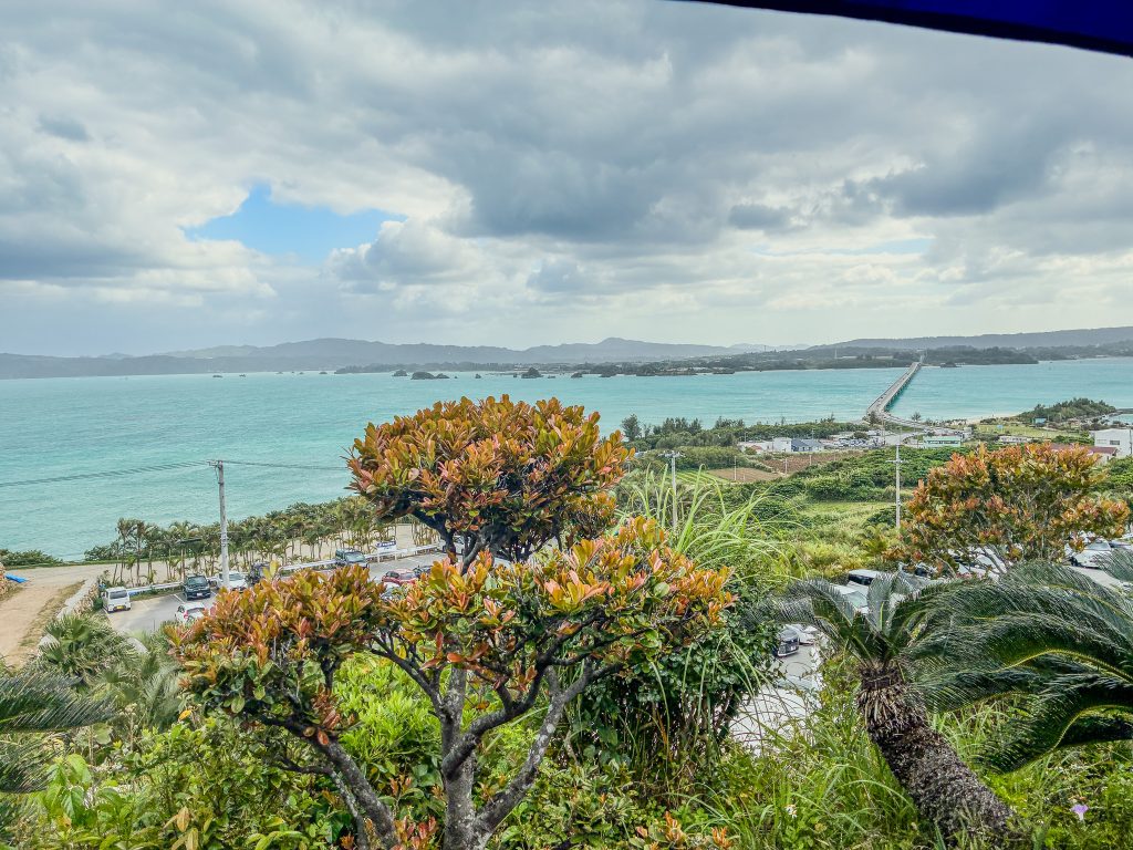Kouri Bridge and emerald sea seen from Kouri Ocean Tower observation deck