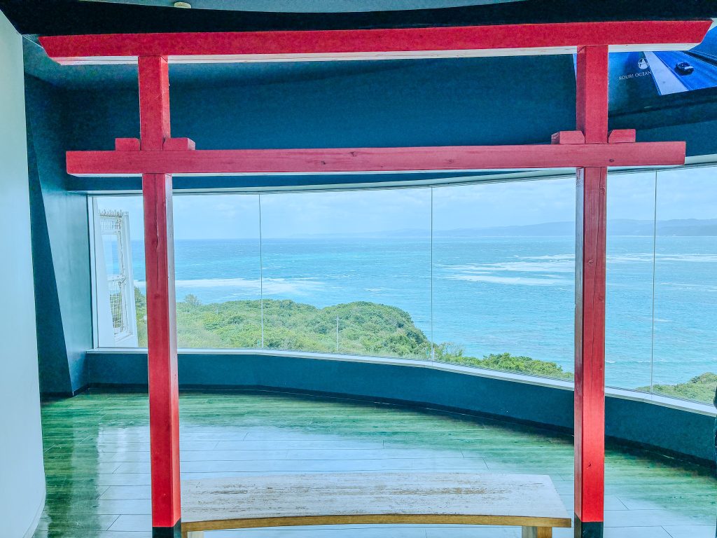 Red torii photo frame inside Kouri Ocean Tower observation deck — must-visit photo spot
