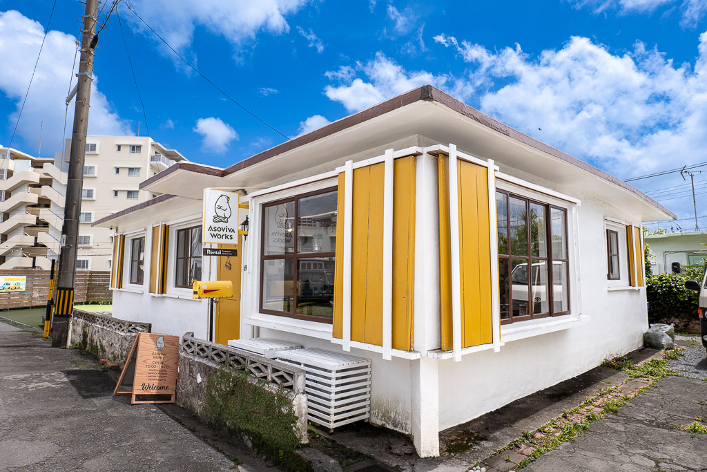 港川 (Minatogawa) Asoviva Works yellow shutter with white walls — Okinawa Urasoe Stateside shop