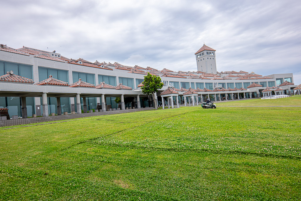 Wide view of museum buildings with grass plaza and Peace Memorial Hall tower