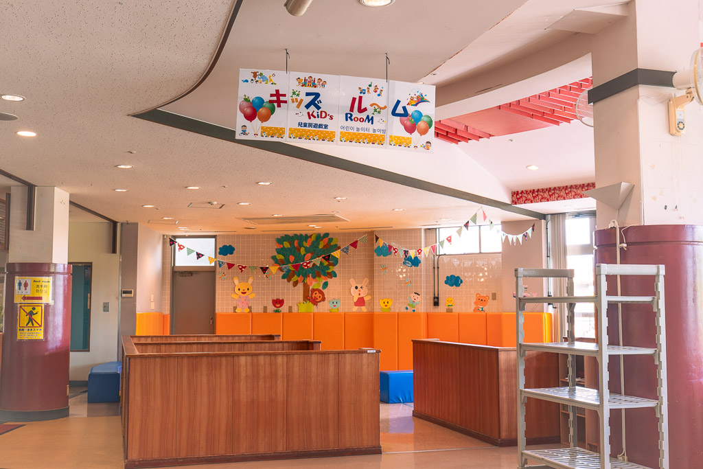 Okinawa World Kids Room — indoor playroom with multilingual signage
