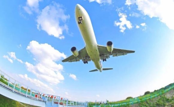 Plane flying low over Senrigawa Dote