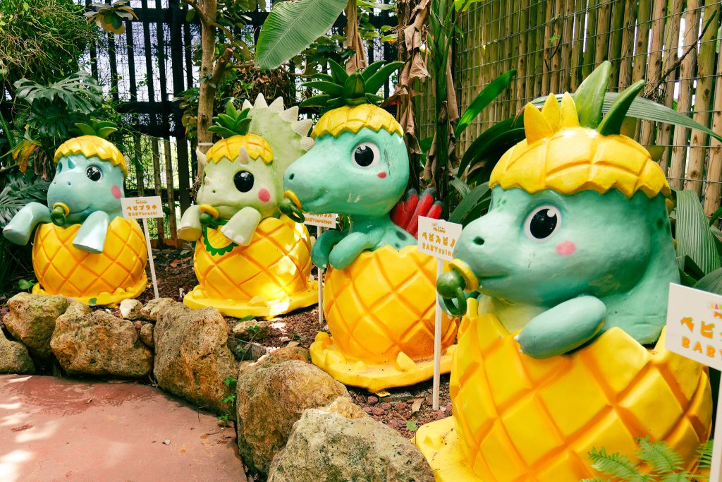 Cute pineapple dinosaur mascots PINASO at Nago Pineapple Park