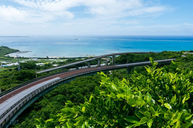 Niraikanai Bridge — 660m sweeping curve toward the sea, scenic drive landmark