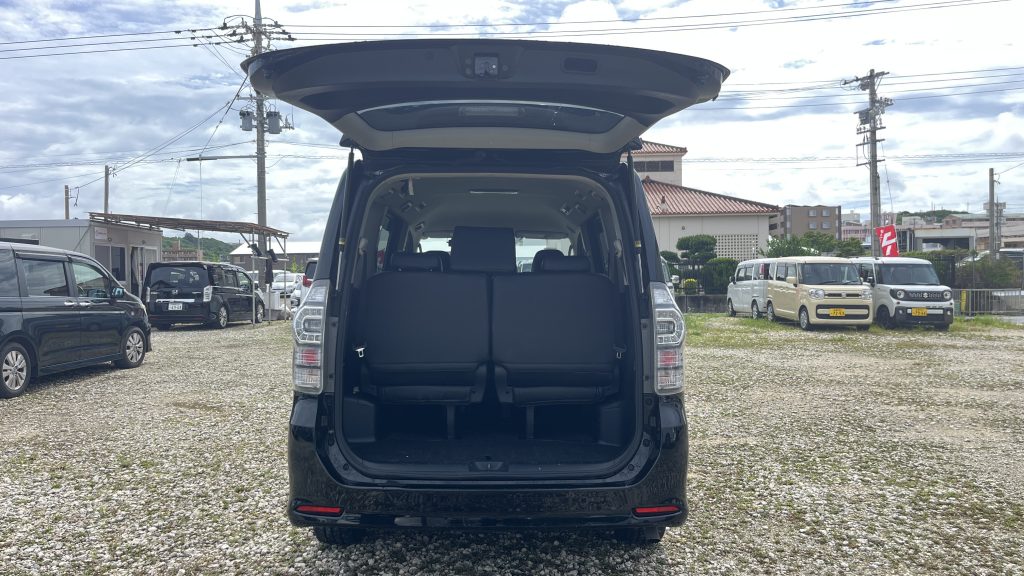 Toyota Voxy trunk — 3rd row deployed, 2 large suitcases