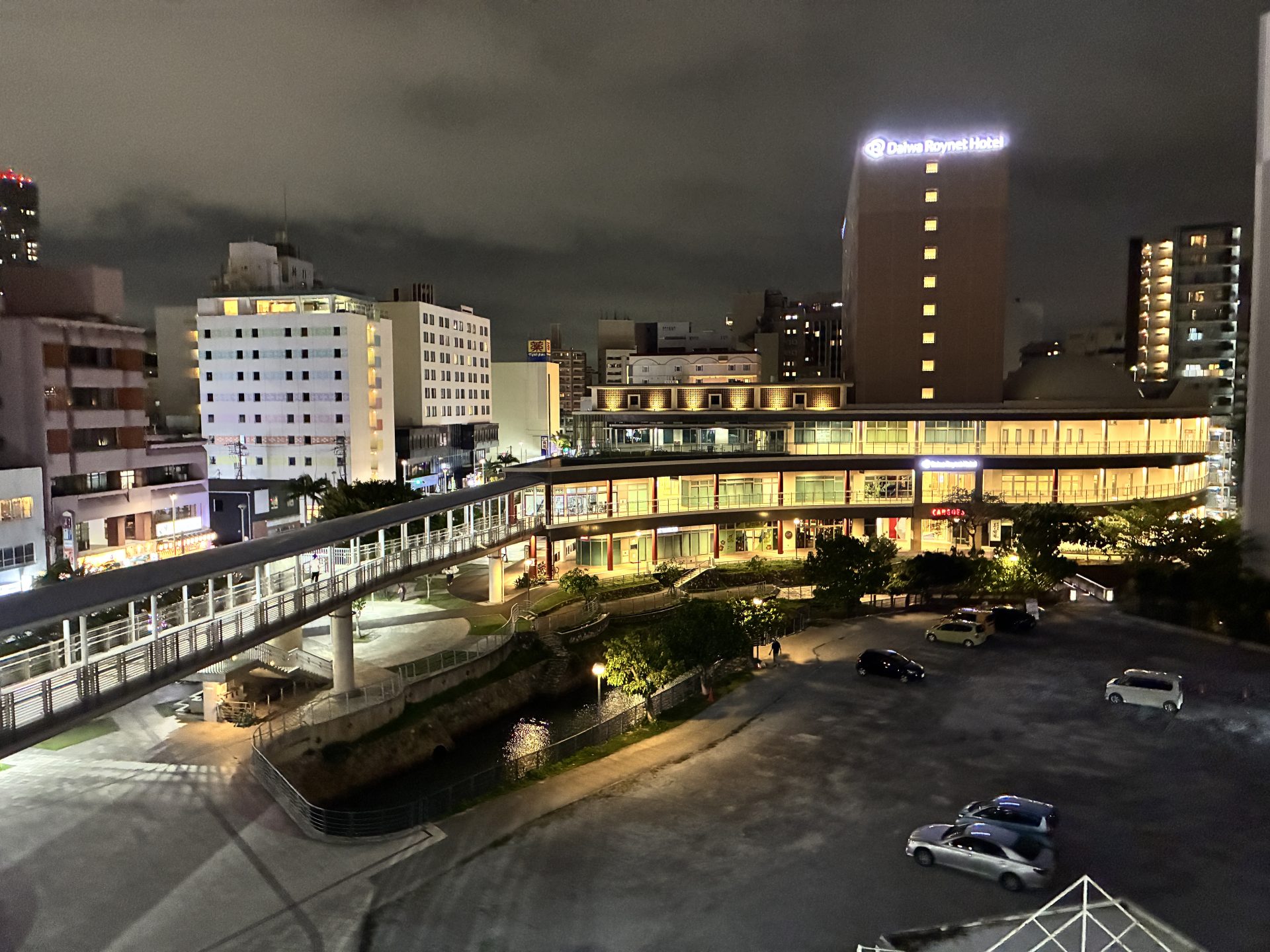 Naha cityscape at night under cloudy skies