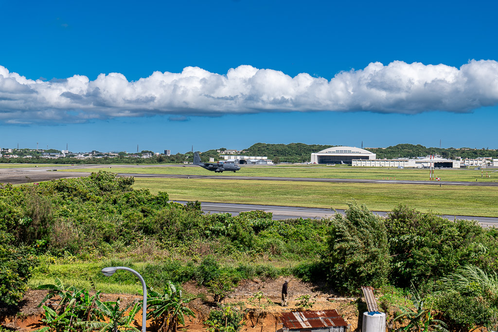 C-130 taxiing along the Kadena Air Base runway after landing