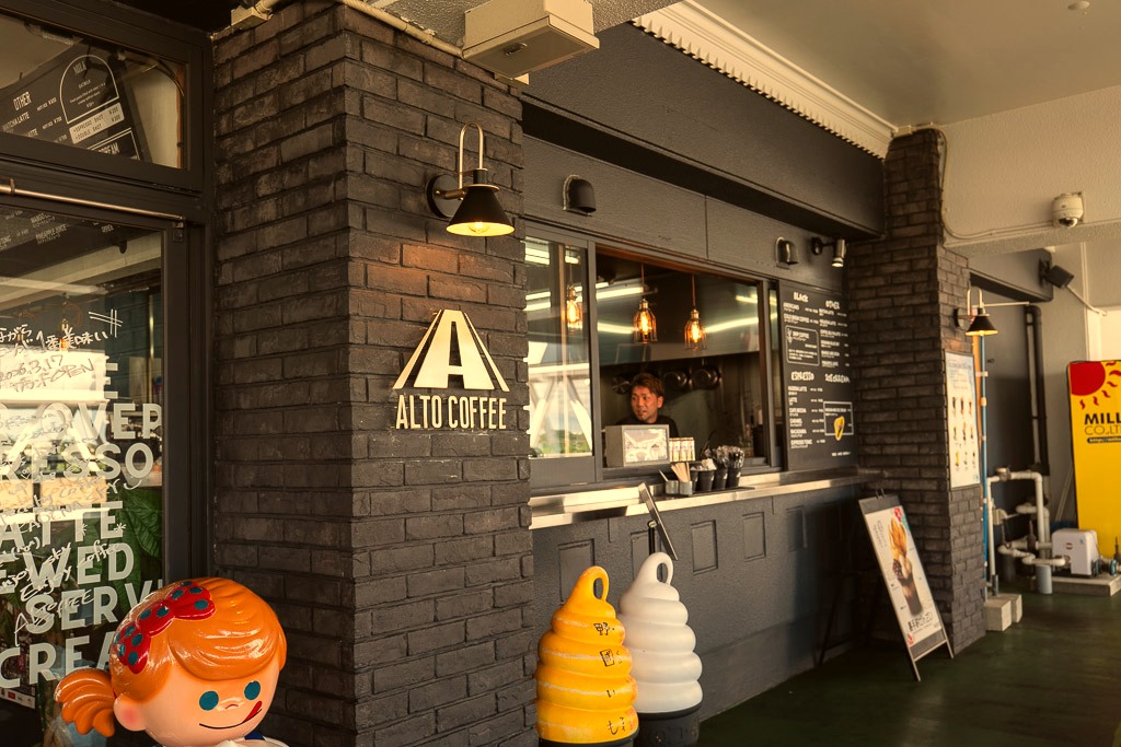ALTO COFFEE stand with black brick walls and soft-serve display at Michi-no-Eki Kadena