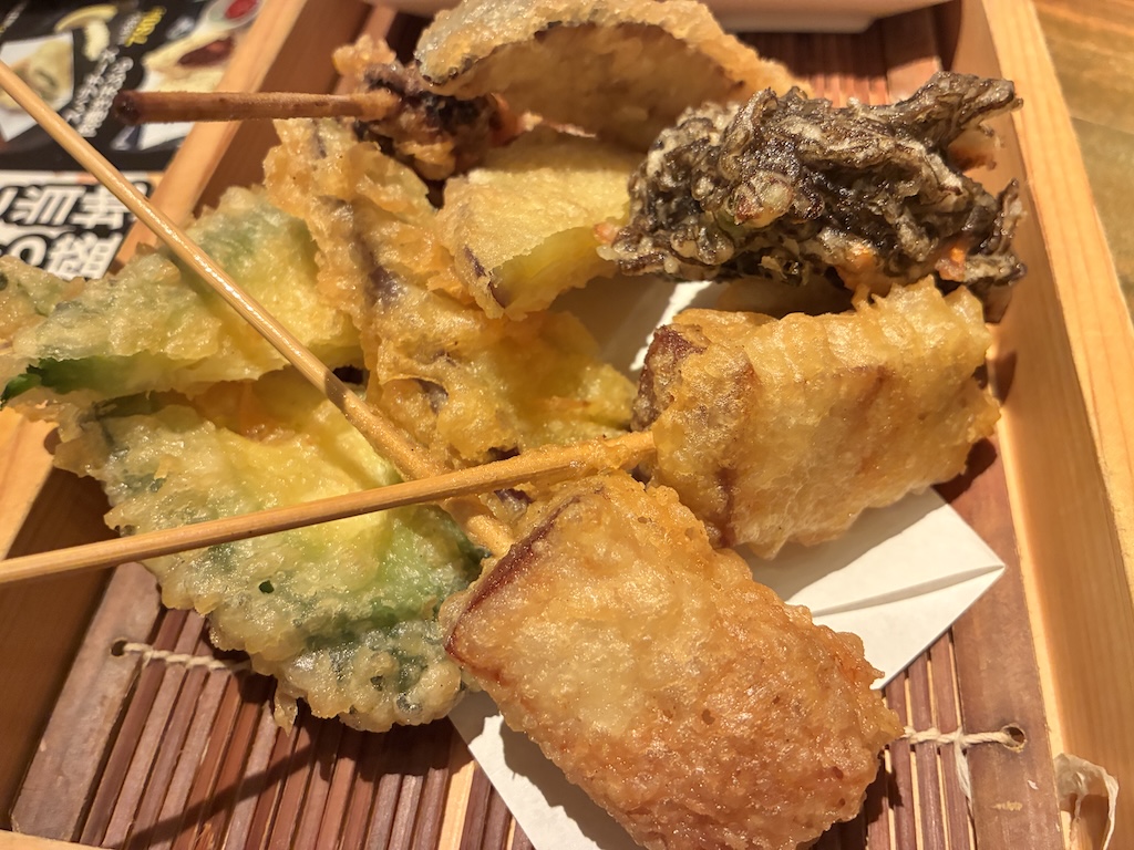 Mixed seasonal tempura platter at Umi no Chinbora served on a bamboo tray