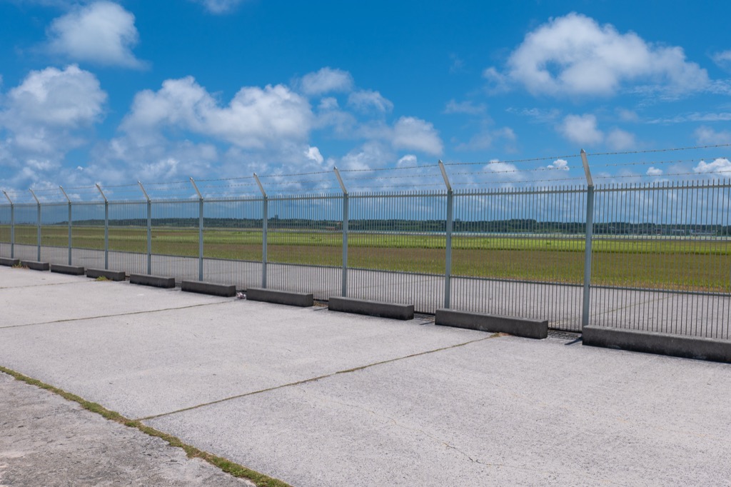 Shimojishima Airport runway viewed through the perimeter fence from the 17END walkway