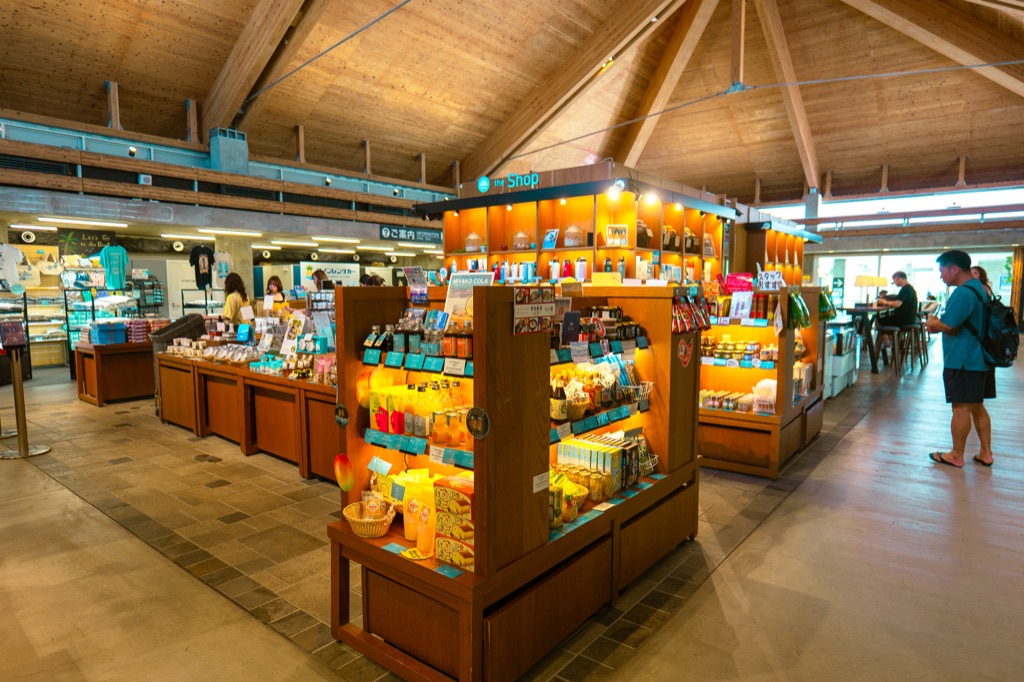 Souvenir shop inside Shimojishima Airport with Okinawan products like Yukishio salt and local snacks