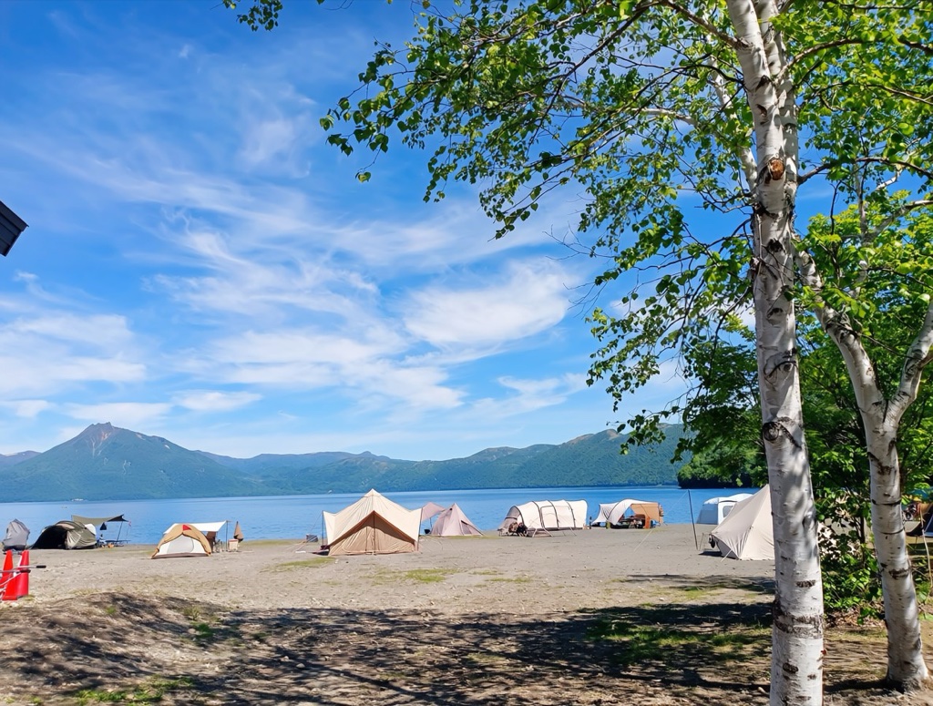 Morappu Campground — close-up of a camper's evening cooking setup with the lake in the background