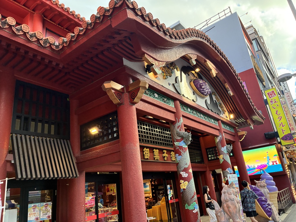 Red-tiled Onkashi Goten confectionery building on Kokusai Street, a landmark for Japan trip shopping