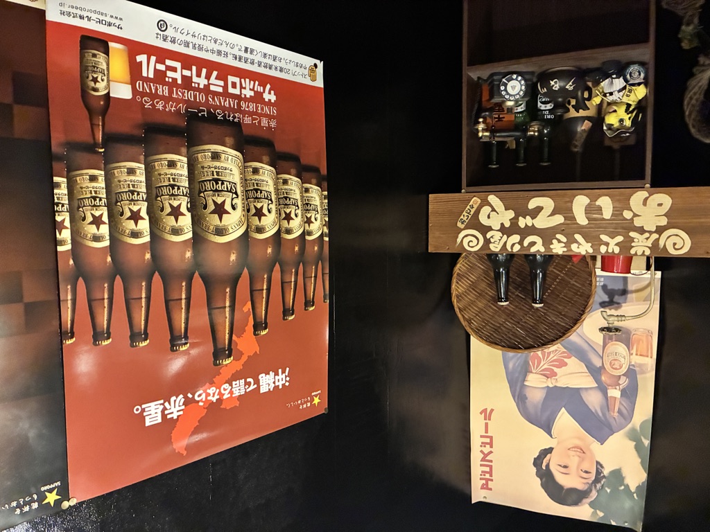 Sapporo Beer vintage poster on a Japanese izakaya wall — nostalgic pub atmosphere