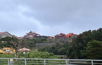 Shuri Castle's scarlet Seiden main hall on the hilltop above Naha at dusk, Okinawa