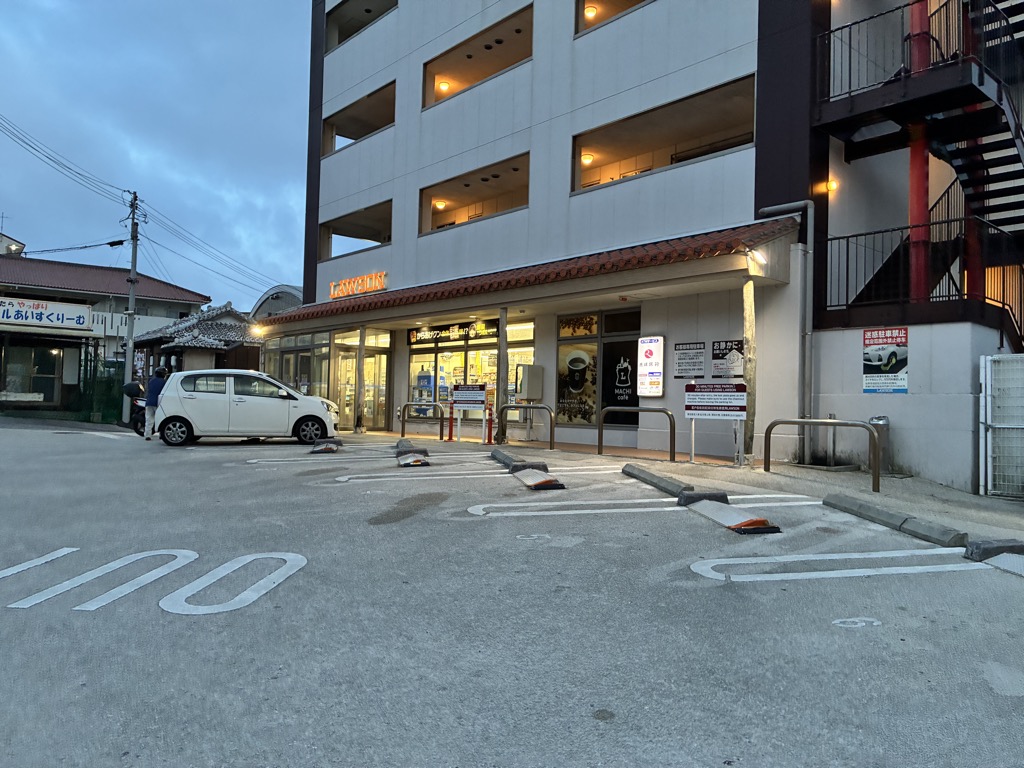 Lawson convenience store with a red-tiled roof and brown signage to match Shuri Castle