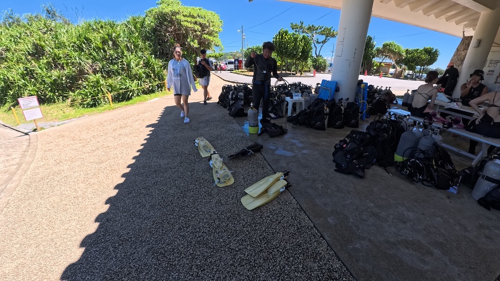 Group of participants receiving safety briefing at Okinawa Blue Cave shop