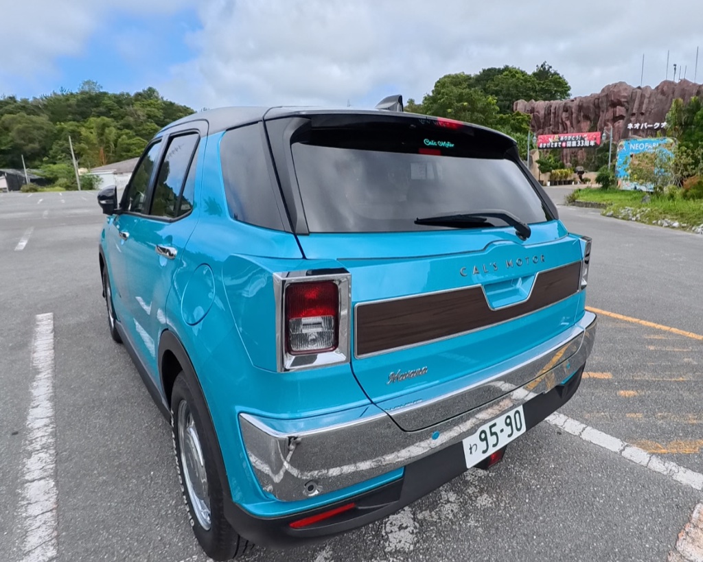 Rear of a rental car returned to the Okinawa depot — with the additional driver registered before departure, both drivers stay covered all the way to return