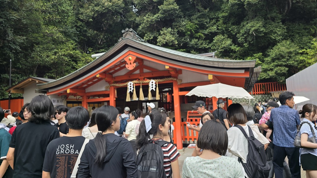 Crowds gathered in front of Fushimi Inari Okusha Hohaisho vermilion prayer hall Kyoto