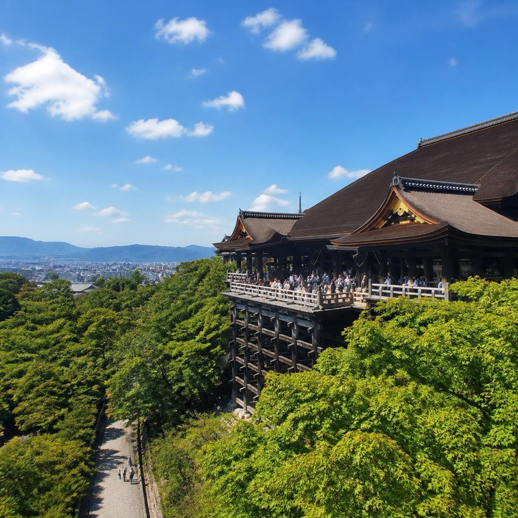 Kiyomizu-dera Temple main hall wooden stage overlooking Higashiyama forest and Kyoto city panorama