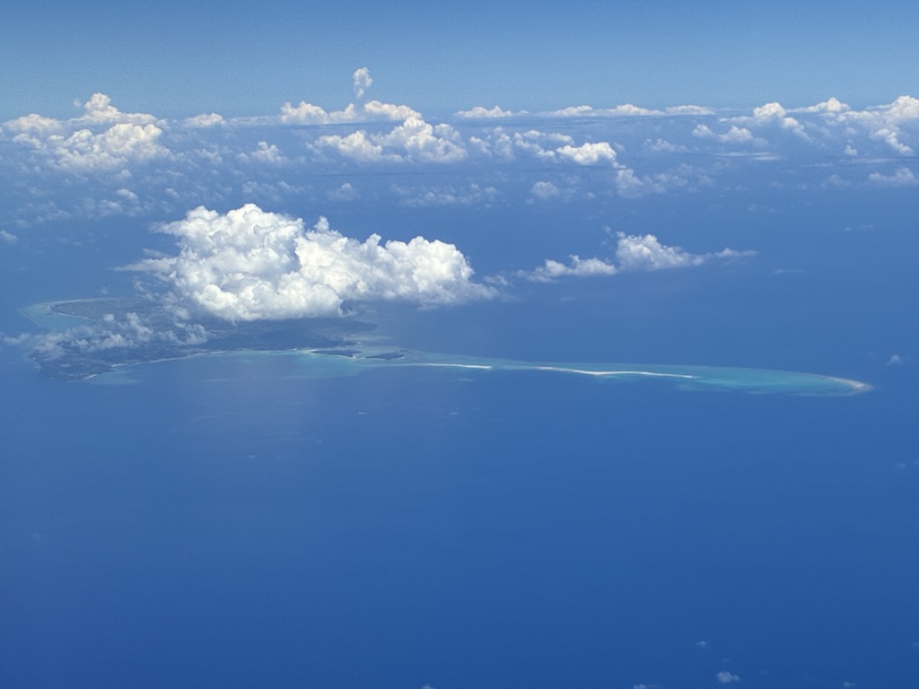 Aerial view of Miyakojima with turquoise Miyako blue coral reefs and long stretches of white sand