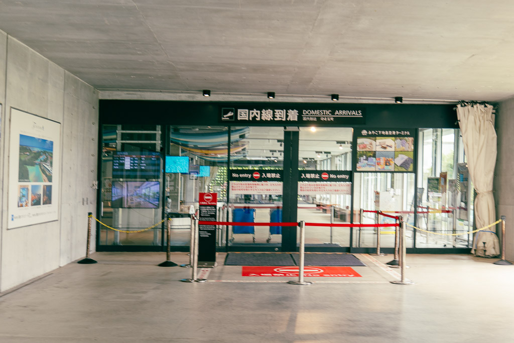 Shimojishima Airport domestic arrivals gate where rental car shuttle pickups meet arriving travelers