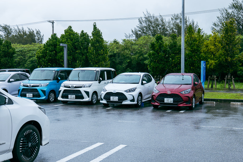 Miyakojima rental car parking lot lineup of compact cars and kei cars