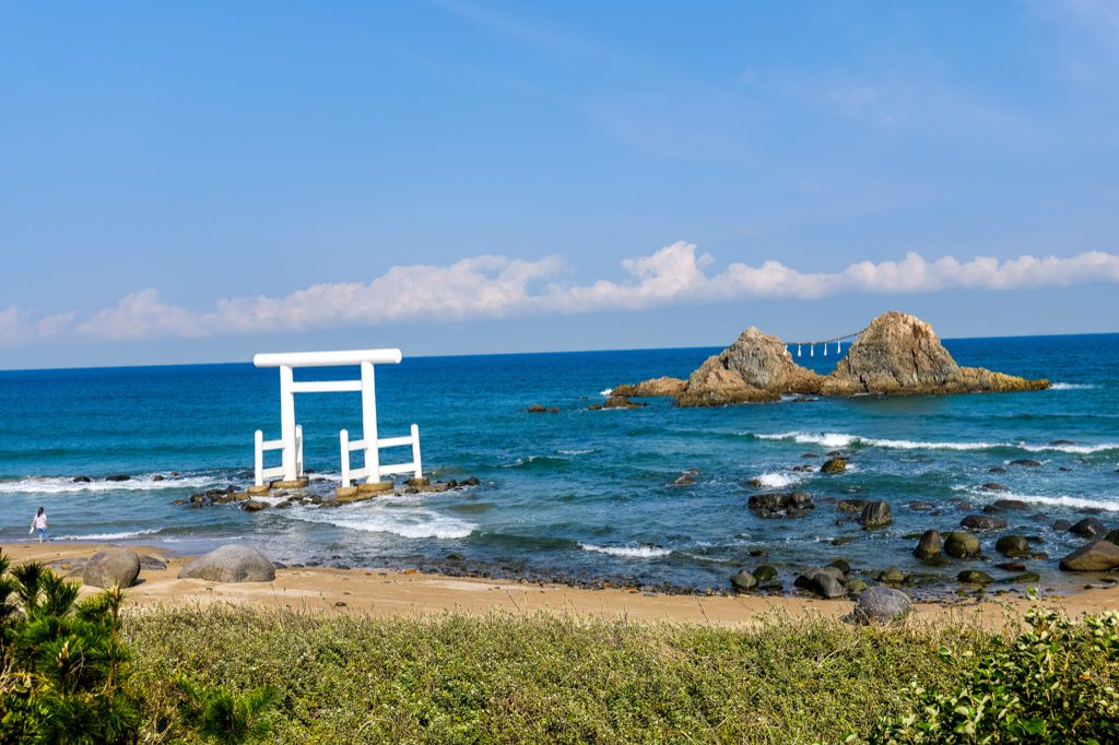 Sakurai Futamigaura white torii gate and the Meotoiwa couple rocks in Itoshima, Fukuoka