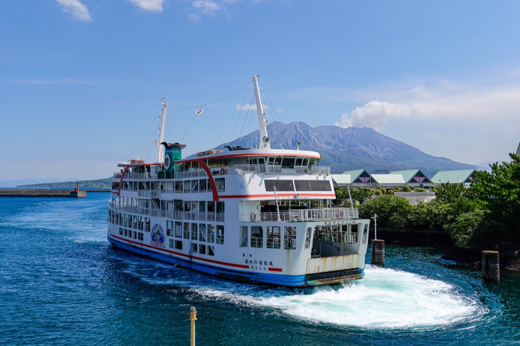 Another ferry passing in front of smoking Sakurajima
