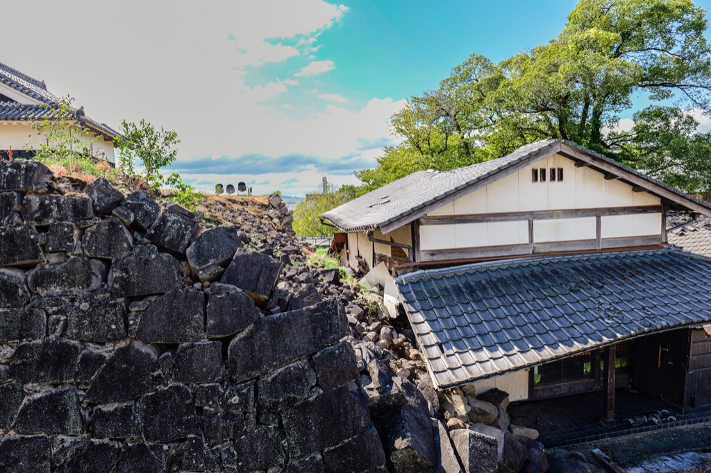 Collapsed stone wall preserved in-situ inside Kumamoto Castle grounds