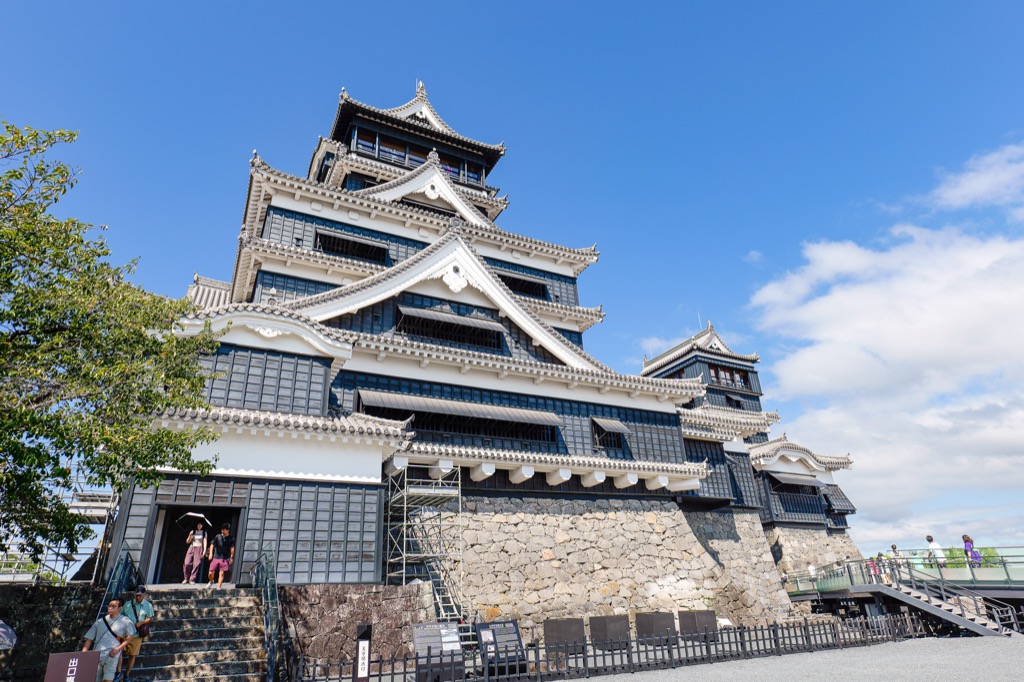 Entrance staircase to the Great Keep of Kumamoto Castle with visitors going in