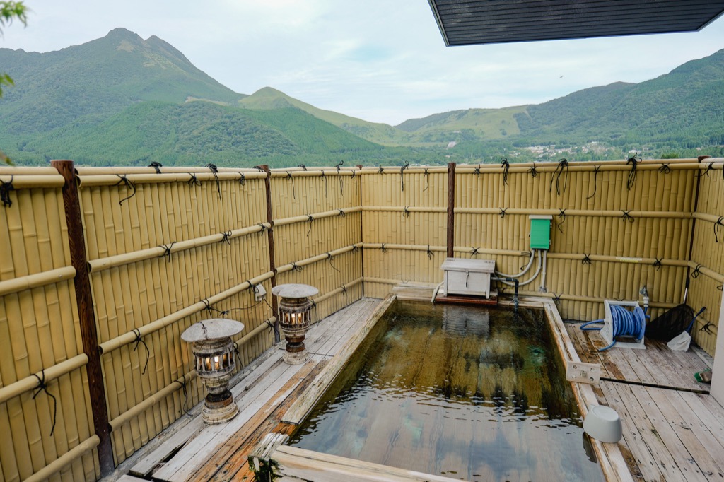 Private open-air bath in a Yufuin ryokan facing Mt. Yufu